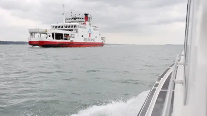 A ferry ship in the sea.