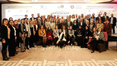 A mixed delegation from ILO, UNWOMEN and OECD pose for a group photo