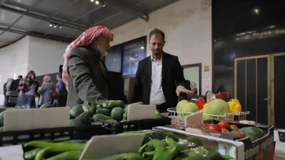 a man selling veggies