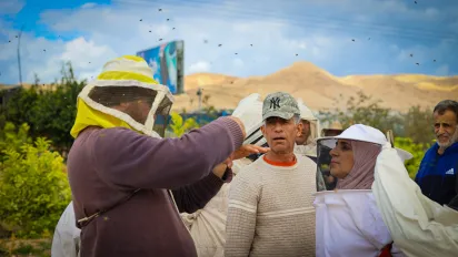 Participants of a beekeeping training and trainer in Jericho