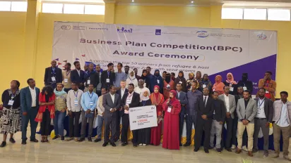 Participants of a business plan competition posing for a group photo