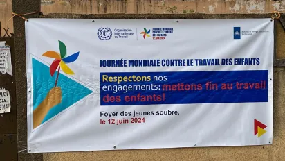 Banner of the world day against child labour in a wall