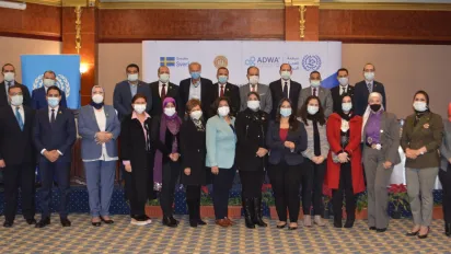 A group of people wearing face masks standing together.