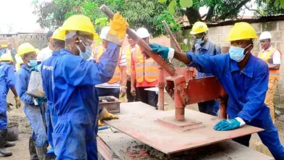 workers manufacturing paving stones