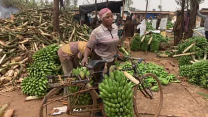 woman carrying banana