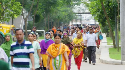 Garment employees are seen leaving a clothing plant at the end of their working day in Bangladesh