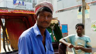 Rickshaw drivers are seen waiting for their next customers in Dhaka.