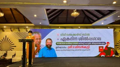 Woman standing behind the podium, on a stage for an event