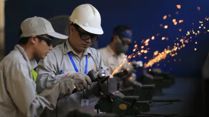 Workers learn skills at a recruitment and training centre before going to work in Japan