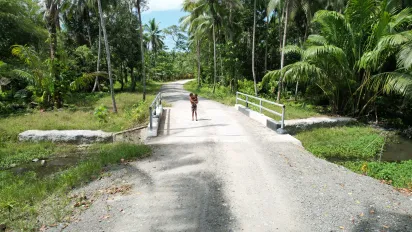 Children walking on a newly rehabilitated road