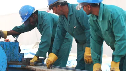 3 men working on a construction site 