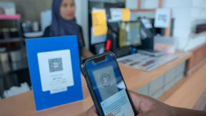 Digital payment using a QR code via a mobile device.