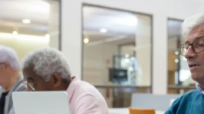 older people working on laptop