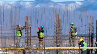 Construction workers on a scaffolding 