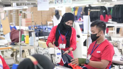 Gender equality in a garment factory in Indonesia with their mask on.