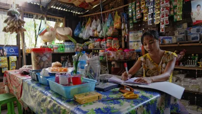 Saleswoman in a little shop in Myanmar