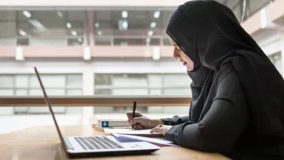 a Woman working with a laptop