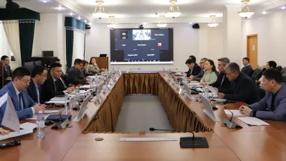 Group of people sitting around the 0-shaped table for the official launch roundtable for the RBSA project in Kazakhstan on 3 December 2024