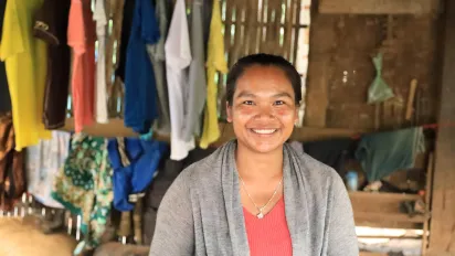 A woman smiles. 