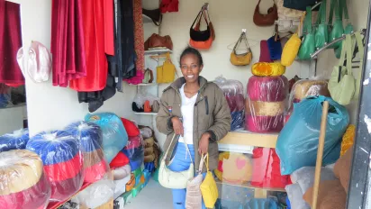 Young Ethiopian woman in her shop looking at the camera