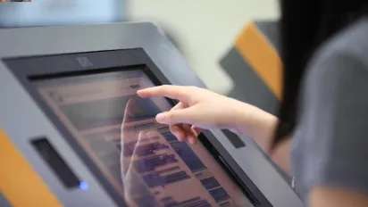 use of touch-screen computer to register and access information