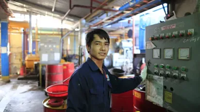 Vietnamese worker at a factory. Factory work is a common job for migrants in Japan