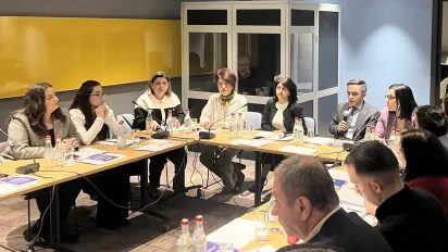A group of people sitting at tables