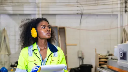 Women manager safety officer inspector work safety checking in factory industry