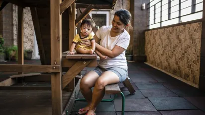 Woman playing with child