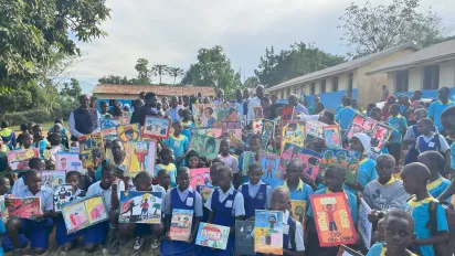 Children with murals, Kalungu District, Uganda, June 2025. 