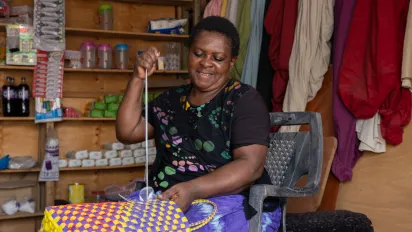 A female basket weaver in her shop