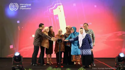 Eight people standing on the stage