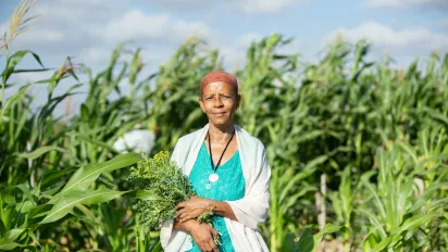 Woman in corn field, Africa