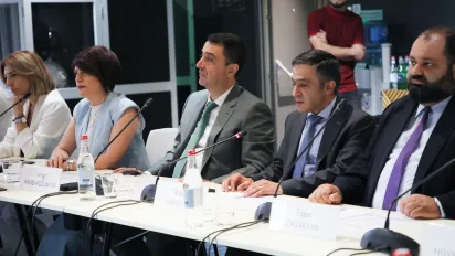 A group of people sitting at a table