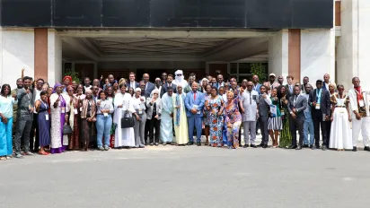 Participants gathered outside the venue at the opening of the 4th Annual West Africa and Sahel Youth Forum in Dakar, featuring young women and men, government officials, and partners.