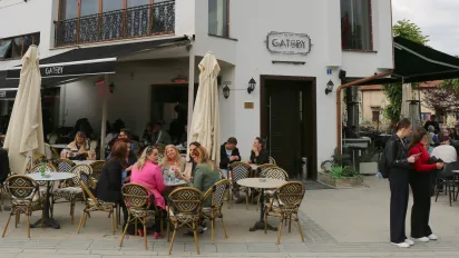 People sitting in an open air cafe