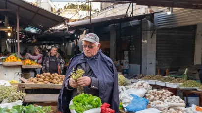 Farmer selling crops at market
