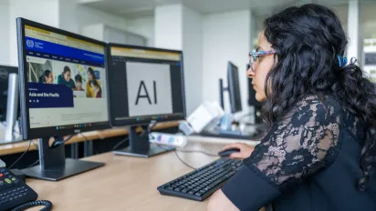 Young intern working at his computer