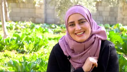 Jordanian woman in her vegetables garden