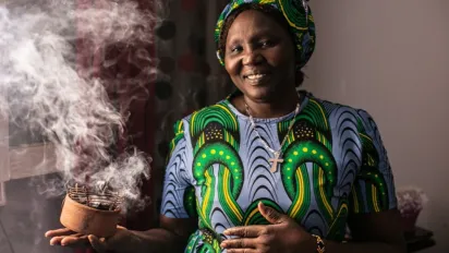 Sudanese women showing her incense sticks she sells in Egypt