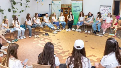 Young women sitting in a circle