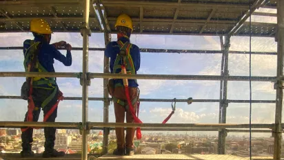 Construction workers at United Nations Building, Bangkok, Thailand.
