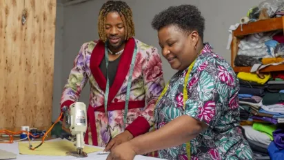 Men in Zimbabwe working in his fashion business