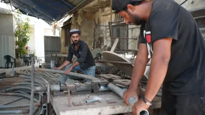 Local welders transforming traditional greenhouse frames into upgraded structures. Akkar, Lebanon. July 2025