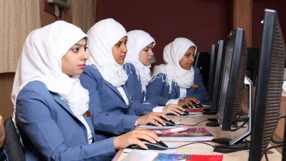 Women work on computers in a vocational training centre in Bahrain.