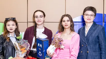 Four students at a gala event 
