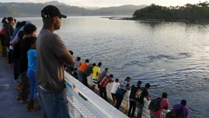 Passengers on a ship in the Pacific islands