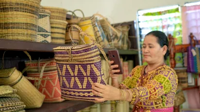 a woman entrepreneur using her mobile phone
