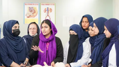 Zahra leads a practical newborn care training session for aspiring health workers in Pakistan