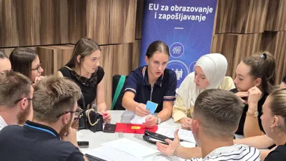Students playing a business game simulation. 